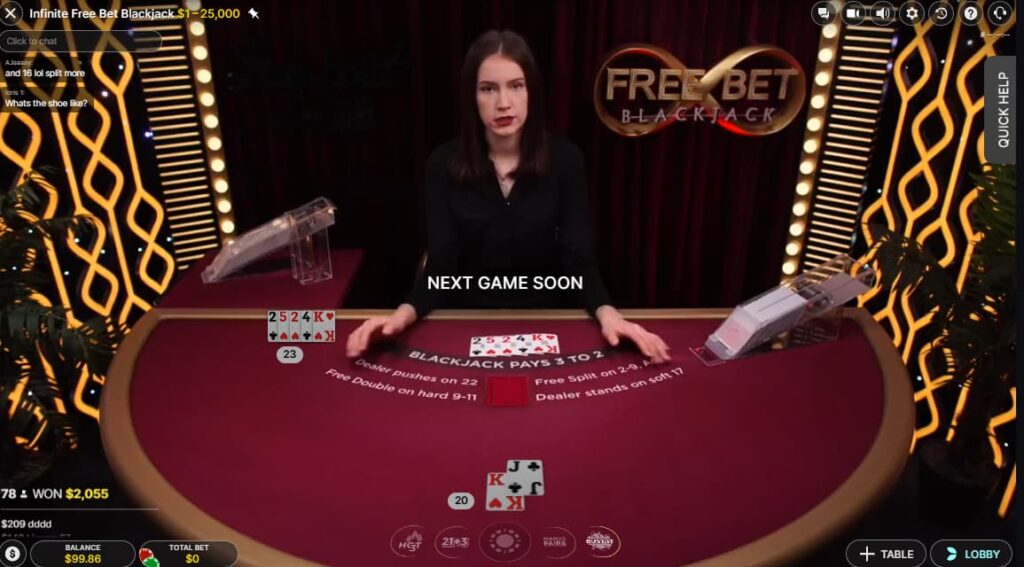 A player shows a King and a Jack in a game of Free Bet Blackjack on CoinCasino.