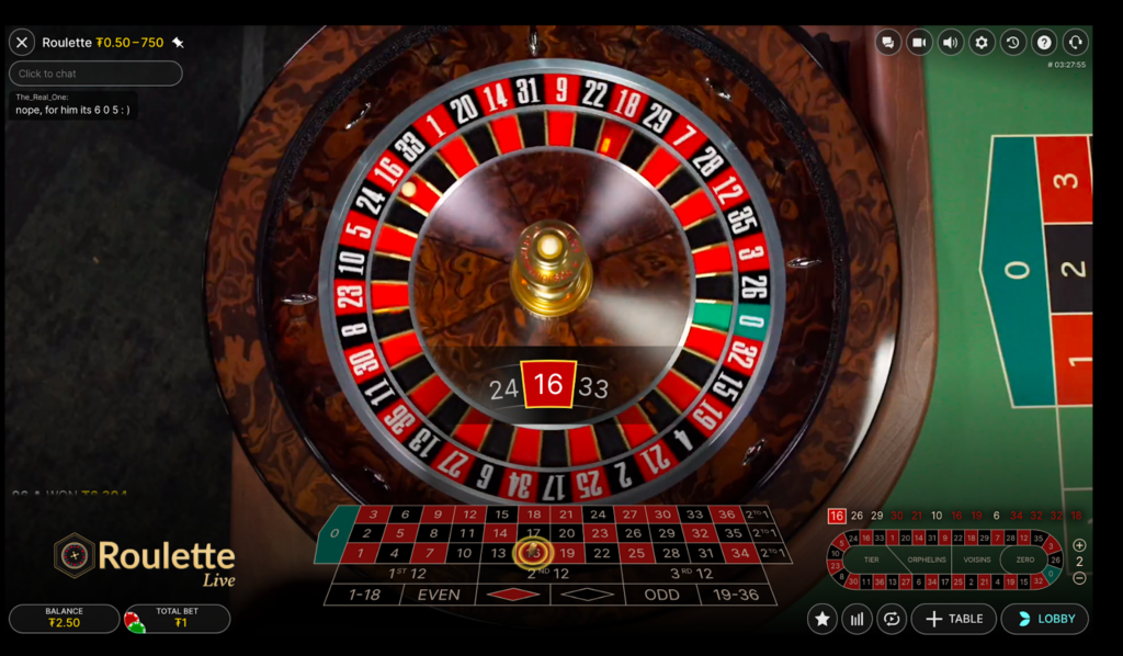 An image showing the ball on 16 red slot of the roulette wheel.