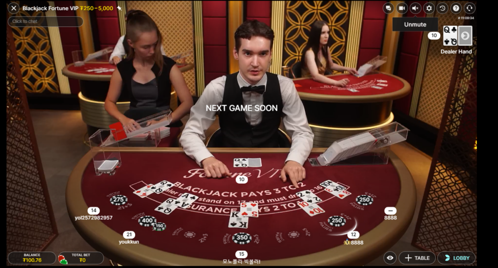 An image of a dealer dealing blackjack hands at an online live casino.