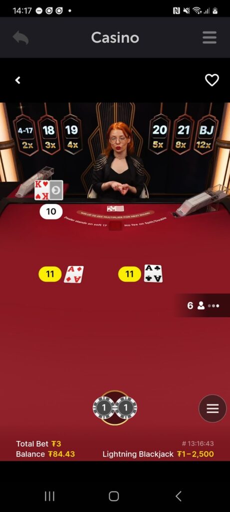 An image of live dealer dealing blackjack cards in CoinPoker online casino app.